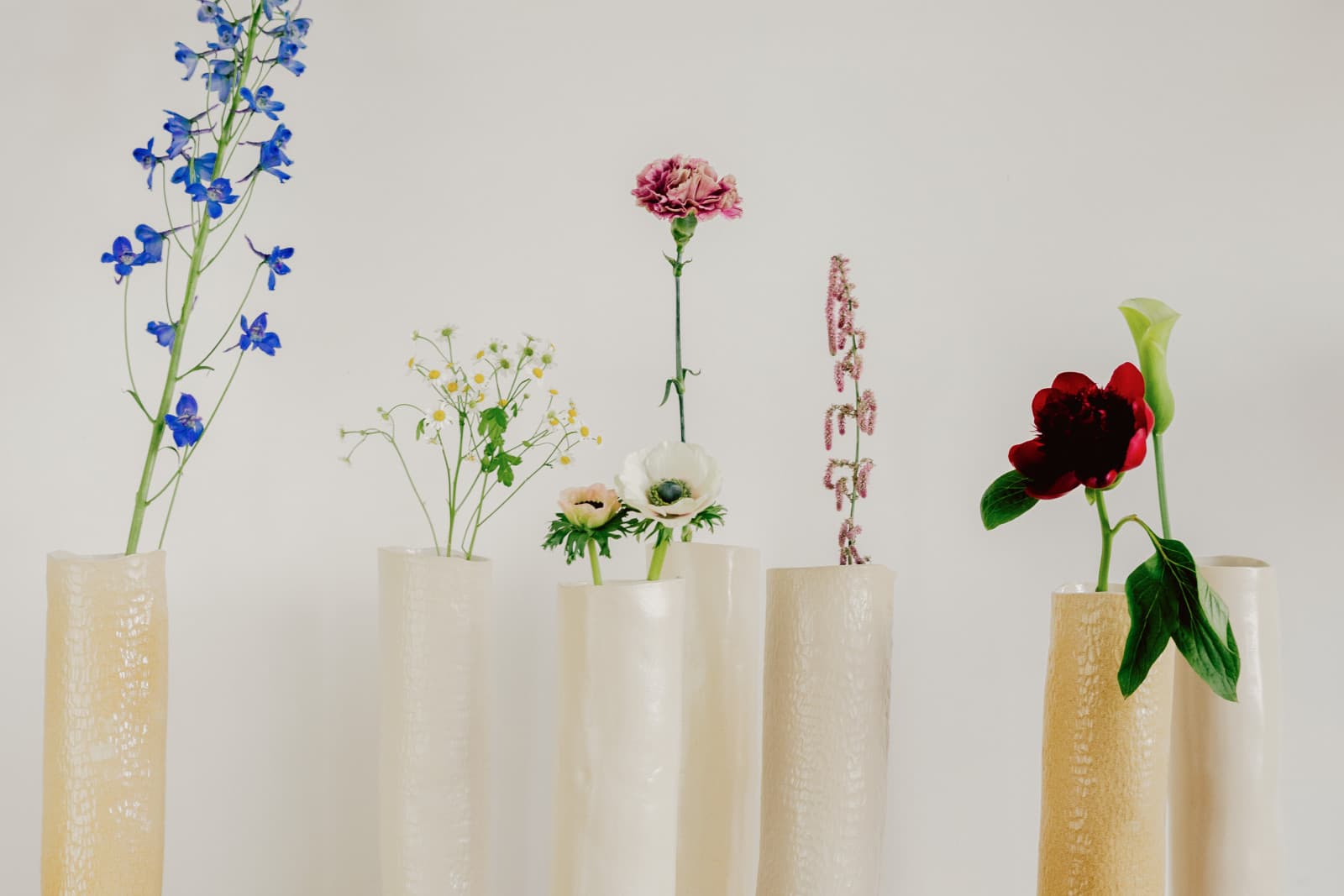 Loose flower stems and small buds on a workbench